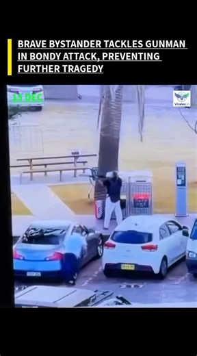 Viralex.in on Instagram: "Hero Civilian Intervenes in Bondi Attack SYDNEY, AUSTRALIA—A civilian has been widely hailed as a hero after video footage captured him tackling an armed individual during the recent terror attack at Bondi Beach. The footage shows the courageous bystander, identified by local reports as Ahmed al Ahmed, rushing forward to confront and disarm one of the alleged gunmen. His swift and brave action is credited with preventing further loss of life during the chaotic incident.