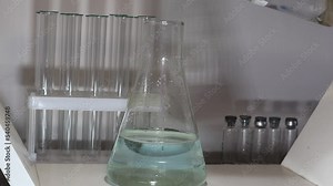 Sulfuric acid in a flask. Dilute sulfuric acid with water. Videos chemicals concept