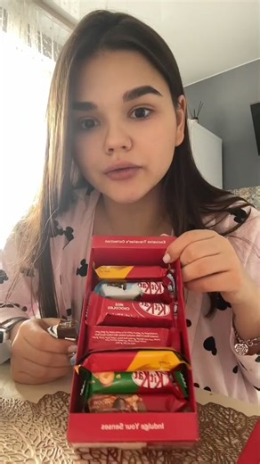 Unboxing KitKat Chocolate Bars in a Cozy Setting