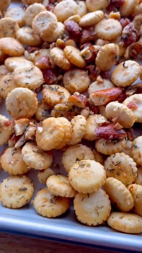 Homemade Spicy Ranch Cracker Mix Recipe. Oyster crackers make this the perfect bite-sized snack. Use whatever nuts you like. Or leave them out. #ranchcrackers #bakedcrackers #oystercra | Cookies Capable