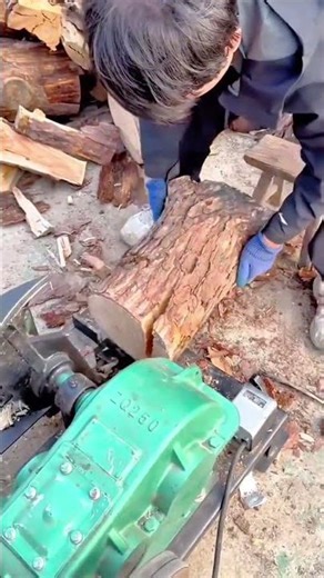Powerful Wood Splitting Machine in Action Breaking Thick Logs with Ease