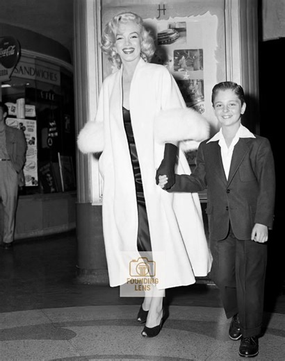 Marilyn Monroe’s Graceful Premiere Moment with Tommy Rettig in 1953 #fblifestyle | Founding Lens