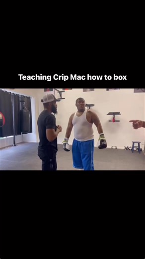 Coach Staff teaching Crip Mac how to box | Andrew Stafford