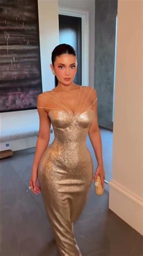 To order this champagne gold dress DM A luminous fitted gown in a soft champagne gold tone,