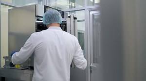 doctor puts the tubes in the refrigerator in the medical laboratory.