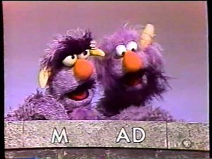 Sesame Street - The Two-Headed Monster spells "MAD"