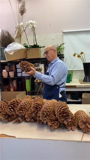 Who would think there’s drilling going on in a flower shop? 😄🌲 At Broadway Florists, creativity comes in all forms — even with a power drill! Getting these giant pine cones ready for our Christmas décor projects for homes and businesses across Winnipeg. 🎄✨ From flowers to pine cones, every detail is handcrafted with love and holiday spirit. ❤️ #broadwayflorists#winnipegflorist #winnipeglocal | Broadway Florists