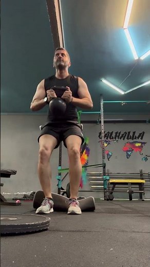 KB deck squat 3 rep