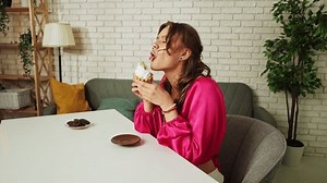 Young Woman Sitting Table Eating Cake Stock Footage Video (100% Royalty-free) 3708203419 | Shutterstock