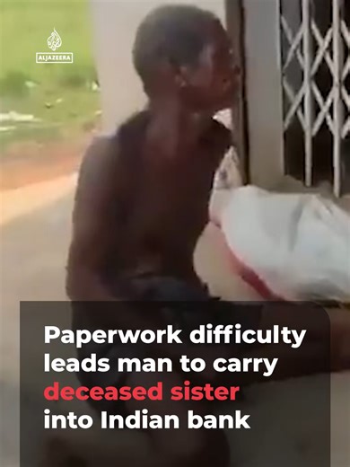A man in rural India was recorded on video carrying the remains of his deceased sister into a bank after he was unable to access her account and needed proof of death.