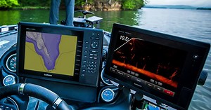 Look at the screen on the right. Those are individual fish you see swimming around a submerged tree in real time. So pick out a big one. | Garmin Marine