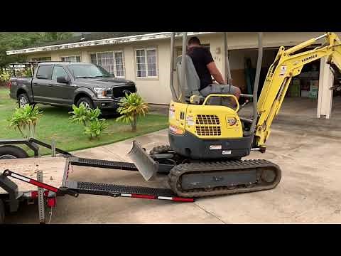 Mini excavator grading