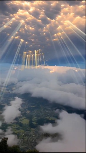 Sun rays scattering through clouds ☀️🌎☁️✨ #clouds #earth #sun #light #sunrays #shortsfeed #shorts
