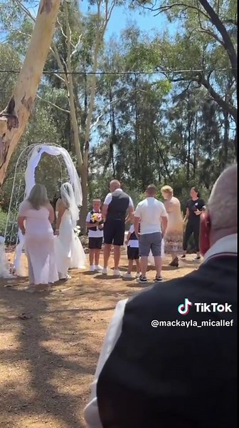 Outdoor Wedding Ceremony Under Canopy of Trees
