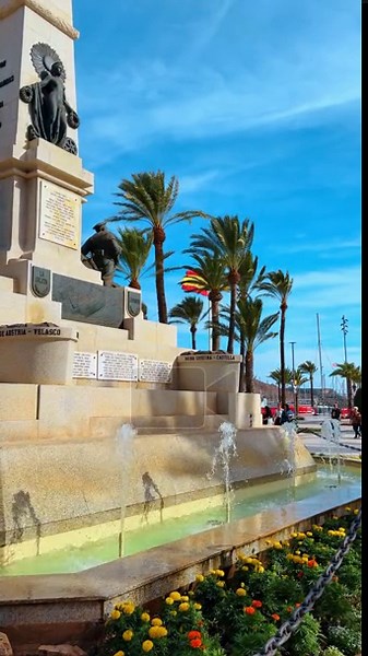 Cartagena, Spain, 8 August 2025: Monument to Heroes of Cavite and Santiago de Cuba. Stone memorial monument with a tiered fountain and palm trees in the port of Cartagena Spain Stock Video Footage - Alamy