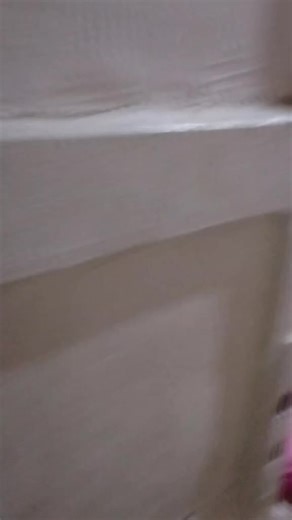 Counting International Currency Notes in a Cozy Bedroom