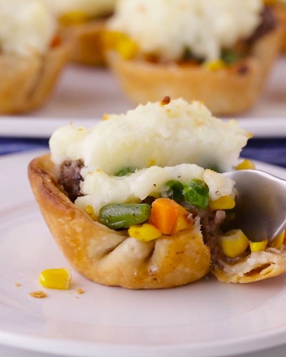 Traditional shepherd’s pie gets a mini makeover in this easy muffin tin recipe. Mini Shepherd's Pot Pies recipe: https://www.pillsbury.com/recipes/mini-shepherds-pot-pies/63263714-df2c-4204-aed5-8b132081d1b0?utm_medium=social&utm_source=facebook&utm_campaign=09_2018_standard | Pillsbury