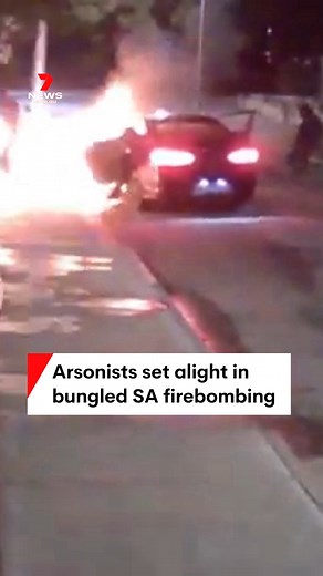 JUST IN: The moment that three would-be arsonists caught fire while attempting to torch a home in Port Pirie has been released by police. CCTV shows that just seconds after the accelerant was doused, the getaway car burst into flames, burning its occupants who then ran off at Solomontown. #Solomontown #PortPirie #7NEWS | 7NEWS Adelaide
