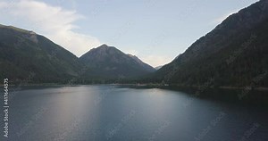 Drone fly over Wallowa Lake State Park, Oregon, USA and surrounding mountain range at dawn