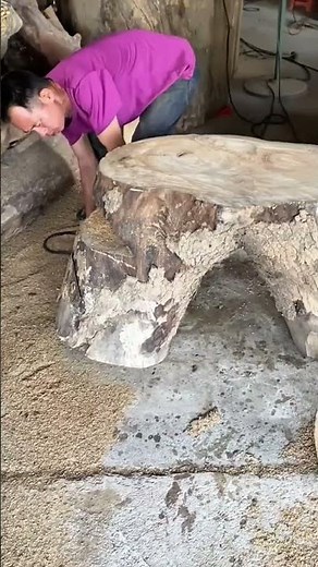 Woodworking craft,Planing a unique tree stump table surface for furniture