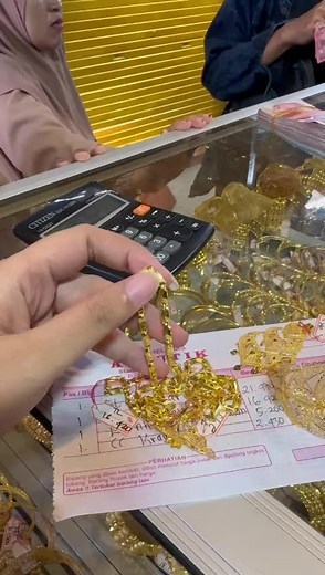 Exquisite Gold-Colored Bangles Display and Inspection