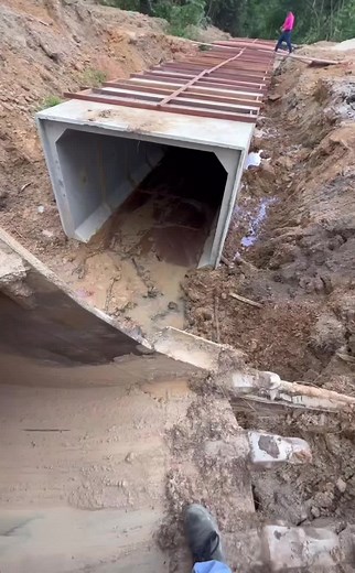 Exploring a Concrete Culvert Pipe at Construction Site