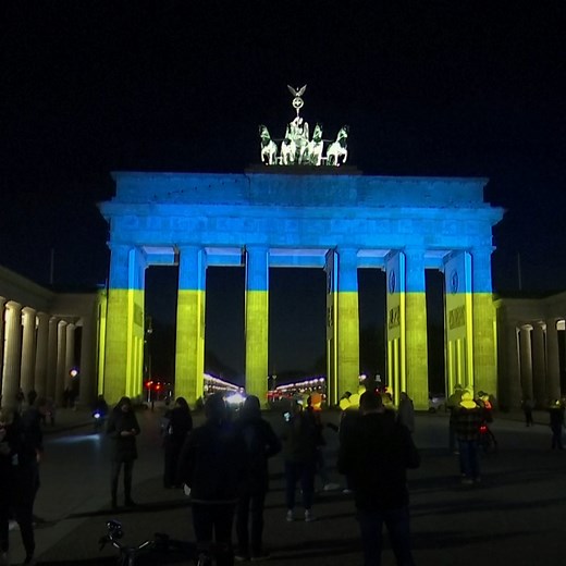 As a show of solidarity, Berlin's Brandenburg Gate was lit up in colors of the Ukrainian flag. | DW News