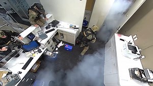 Video from inside Fla. bank during hostage situation shows SWAT officer neutralize suspect with one shot