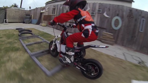 Paxton Booth tunes up for the next EnduroCross on the Oset 12.5R electric trials bike right from his backyard. | Cycle News