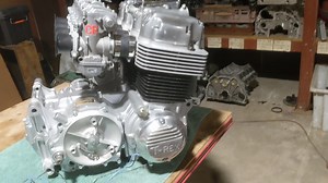 Mad engine stuff, engine ready to go into bike. Just refreshed a TRex 1150 cc engine. Made some RPE adjustments, 1, Machined the Boldor crank into a nice race crank, 2, Replaced the cracked barrel with new heavy walled sleeves and with no welding of barrell which allow cool air through the cylinders like O/E. 3, manufactured new H beam rods 114.5 mm, this allows the dropping of the spacer under the barrel, stronger and has oil squirters. 4, reconfigured the spigots on the head for better breathi