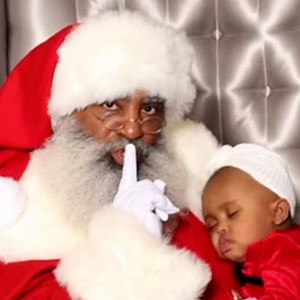 These pictures of this baby sleeping on Santa will melt your heart