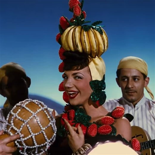 Broadway & Beyond on Instagram: "Happy birthday to the one and only Carmen Miranda 🎉🍌 Fruit, rhythm, and movie-musical joy 🍓🍍 #CarmenMiranda #Birthday #TheLadyInTheTuttiFruttiHat #MovieMusicals #ClassicHollywood"