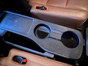Highlander 2nd row flip up cup holder tray table