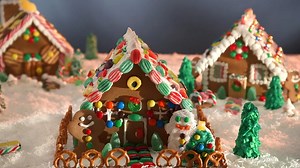 Creating one of a kind gingerbread houses is a cherished holiday tradition for many families. Every year kids look forward to building, decorating and really making them their own. Click to watch our fool-proof recipe video. | Bulk Barn