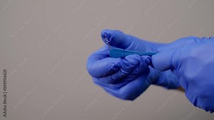Activation Key for Palatal expander mechanism. Orthodontist in gloves holding Orthodontic plate Activation Key. Dentist specialist show professional equipment. Healthcare and medicine