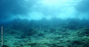 choppy water wavy sea underwater wave hit on rocks and makes foam on the surface of the sea ocean scenery