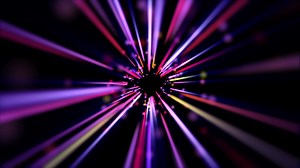 Download Seamless loop featuring a tunnel effect of fast moving purple and blue particles and light beams. Full HD and looping motion background. for free