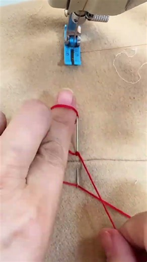 sewing precise red thread patterns using specialized industrial machine