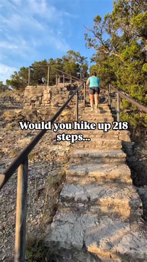 The best place to catch a Texas sunset is from the top of Old Baldy in Wimberley, TX. The hike to the top is short, but it's entirely made up of steps, so it's definitely a workout! Would you climb these stairs? Have you? #wimberleytx #wimberleytexas #oldbaldy #texassunset | Texas Wanderers