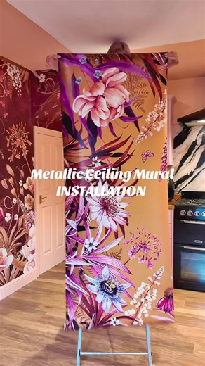 Hanging my own wallpaper design called Blooms of Midas on a lowered ceiling panel above my dining table. I had the husband out with the trusty broom 🧹 😆 but it worked and I’m so happy with the result! Chandelier to go back up now and I can reveal the vision for my new glam kitchen! #kitchendesign #wallpaperaesthetic #ceilings #diningroom