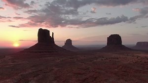 Monument Valley Sunrise Over Buttes Aerial Shot Rotate R Navajo Nation Southwest Desert Arizona Utah USA