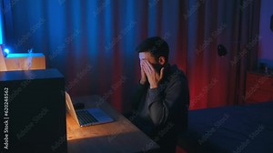 Fatigue from working at the computer. fatigue due to the laptop screen. Male use computer rubbing tired eyes. Handsome man rubbing tired eyes, yawn and want to sleep. Problem with eyes, eyesight or