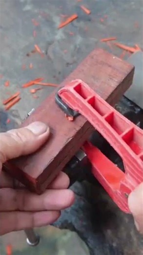 the process of installing a file on a wooden handle that has been carved