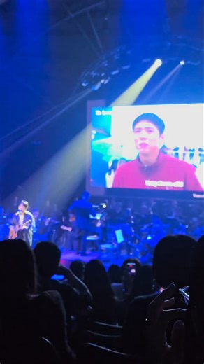 @togethermanila on Instagram: "🍊✨ Isaac Hong (@pngisac) graced the stage with his heartfelt performance of "My Love By My Side," his song from the hit K-drama "When Life Gives You Tangerines,” accompanied by the Philippine Philharmonic Orchestra (@philharmonicph)! 🎶💛 It was one of the highlights of @kccphil’s OST Symphony: K-Drama in Concert, celebrating the magic of K-drama music live at @smaurapremiere. #IsaacHong #WhenLifeGivesYouTangerines #KDramaOST #ParkBogum #IU #KDramaInConcert #KCCPh