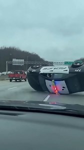 Police Cruiser Flips on I-71 Columbus, Ohio — March 15, 2024 A routine day on Interstate 71 took a terrifying turn Friday when a police cruiser hydroplaned on the wet pavement and flipped multiple times in front of shocked motorists. The officer was reportedly responding to a call when the incident occurred during a period of light rain. The dramatic footage, captured by a motorist traveling behind the officer, begins with the cruiser speeding down the highway with its lights flashing. Suddenly,