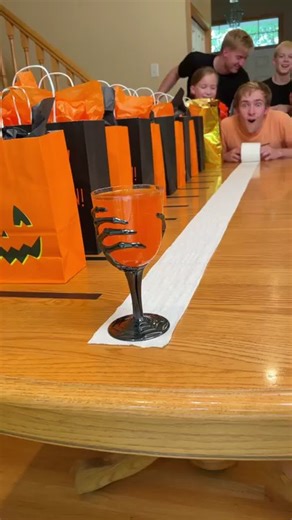 "Spooky Halloween Wine Glass Challenge 🎃 Kids, Dad, and family play easy diy halloween game with scary wine glass, toilet paper, and party bags. Great game for costume parties, halloween parties, and fall events. (for entertainment purposes only)" 🎬 This video was produced by Network Media and Benson Bros | Challenge Accepted
