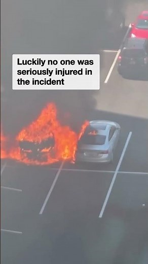 Wild moment burning car explodes in parking lot