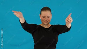 Pleased woman waves head back and forth at rock concert. Girl head bobbing to beat in perfect synchronization with roaring crowd and pulsating rhythms