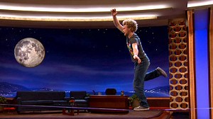 Andy Lewis slacklines across the #CONAN stage. | Team Coco