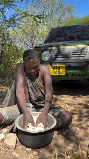 Dudukwe prepare traditional baobab bush fruit juice for the tribe today